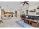 Open concept room with living area, eat in kitchen, tile flooring, and leather furniture at 267 Osprey Hammock Trl, Sanford, FL 32771