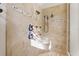 Walk-in shower with tile surround, multiple shower heads, and built-in bench at 267 Osprey Hammock Trl, Sanford, FL 32771