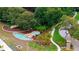 Aerial view of community entrance with water feature, lush landscaping, and manicured grounds at 267 Osprey Hammock Trl, Sanford, FL 32771