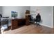 Bedroom featuring wood floors, a ceiling fan, and a large desk with a computer at 2729 Stanwood Dr, Kissimmee, FL 34743