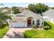 Beautiful one-story home with lush green lawn, well maintained landscaping, and a two car garage at 2729 Stanwood Dr, Kissimmee, FL 34743