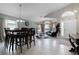 Open-concept living room with tile floors, lots of natural light, and stylish furniture at 2729 Stanwood Dr, Kissimmee, FL 34743