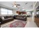 Open concept living room and kitchen area featuring tile floors, lots of natural light, and bar seating at 2729 Stanwood Dr, Kissimmee, FL 34743