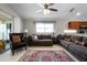 Spacious living room with plush seating, tile floors, and sliding glass doors to the patio at 2729 Stanwood Dr, Kissimmee, FL 34743