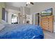 Light and airy main bedroom with vaulted ceiling, dresser, walk-in closet and patio access at 2729 Stanwood Dr, Kissimmee, FL 34743