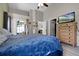 Light and airy main bedroom with vaulted ceiling, dresser, walk-in closet and patio access at 2729 Stanwood Dr, Kissimmee, FL 34743