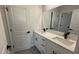 Bathroom featuring dual vanity, granite counters, and black hardware at 285 Marion Oaks Crse, Ocala, FL 34473