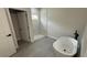 Bright bathroom with a soaking tub, a glass shower, and marble look tile for a luxurious experience at 285 Marion Oaks Crse, Ocala, FL 34473