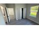 Bedroom featuring gray vinyl flooring, a closet, and natural light at 285 Marion Oaks Crse, Ocala, FL 34473