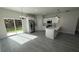 Eat-in kitchen with stainless steel appliances, white cabinetry, and sliding glass door at 285 Marion Oaks Crse, Ocala, FL 34473