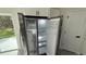 Kitchen featuring stainless steel refrigerator with open doors at 285 Marion Oaks Crse, Ocala, FL 34473