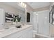 Modern bathroom features double sinks, neutral tones, and walk-in shower at 3367 Vine Leaf St, Apopka, FL 32712