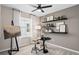 Bedroom featuring an easel, artist decor, and wall shelving with plants at 3367 Vine Leaf St, Apopka, FL 32712