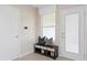 Inviting entryway features a bench with storage and access to the outdoors at 3367 Vine Leaf St, Apopka, FL 32712