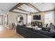 Bright living room with wooden beam ceilings, recessed lighting, and ample seating at 3367 Vine Leaf St, Apopka, FL 32712