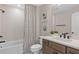 Modern bathroom featuring sleek fixtures, a shower-tub combo, and a neutral color scheme creating a spa-like experience at 3373 Orange Rose Loop, Apopka, FL 32712