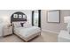 Charming bedroom showcases a unique accent wall, stylish decor, and ample natural light, creating a cozy retreat at 3373 Orange Rose Loop, Apopka, FL 32712