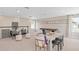 Spacious living room featuring neutral walls, comfortable seating, and an inviting atmosphere perfect for relaxation and entertainment at 3373 Orange Rose Loop, Apopka, FL 32712