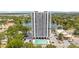 Stunning aerial view of Park Lake Towers featuring a pool, beautiful lake, and picturesque surroundings at 400 E Colonial Dr # 207, Orlando, FL 32803
