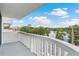 Balcony view of lake and trees with city skyline, a tranquil outdoor living space at 400 E Colonial Dr # 207, Orlando, FL 32803