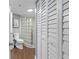 Bathroom featuring a shower, toilet, storage, and a view of the skylight at 400 E Colonial Dr # 207, Orlando, FL 32803