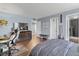 Bedroom with modern desk and a view into a bathroom at 400 E Colonial Dr # 207, Orlando, FL 32803