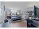 View of bedroom featuring sleek furnishings, modern décor, and bright natural light from the window at 400 E Colonial Dr # 207, Orlando, FL 32803