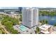 Scenic view of Park Lake Towers overlooking a tranquil lake with a fountain and well-maintained grounds at 400 E Colonial Dr # 207, Orlando, FL 32803