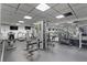 Well-equipped gym featuring various exercise machines, televisions, and mirrored walls for a complete workout experience at 400 E Colonial Dr # 207, Orlando, FL 32803