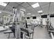 Well-equipped gym featuring various exercise machines and televisions for a complete workout experience at 400 E Colonial Dr # 207, Orlando, FL 32803