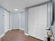 Hallway view with storage closet and door and modern flooring design at 400 E Colonial Dr # 207, Orlando, FL 32803