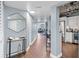 Hallway leading to the living room, showing a modern interior with an exposed kitchen at 400 E Colonial Dr # 207, Orlando, FL 32803