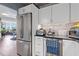 Modern kitchen with stainless steel appliances and view into the living room at 400 E Colonial Dr # 207, Orlando, FL 32803