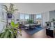Spacious living room with balcony access offering scenic views and abundant natural light at 400 E Colonial Dr # 207, Orlando, FL 32803