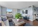 Living room includes a large window, entertainment center, and comfortable sectional at 400 E Colonial Dr # 207, Orlando, FL 32803