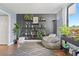 Relaxing living room featuring modern shelves, a beanbag chair, and great view from a large window at 400 E Colonial Dr # 207, Orlando, FL 32803