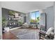 Inviting living room features modern decor, a beanbag chair, and views from a large window at 400 E Colonial Dr # 207, Orlando, FL 32803