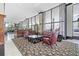 Elegant lobby features comfortable seating, stylish decor, and large windows offering natural light and neighborhood views at 400 E Colonial Dr # 207, Orlando, FL 32803