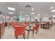 Spacious lounge with comfortable seating, tables, and tasteful decor, ideal for socializing or relaxing at 400 E Colonial Dr # 207, Orlando, FL 32803