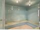 Sauna with tiled walls and floors. Multiple overhead lights at 400 E Colonial Dr # 207, Orlando, FL 32803