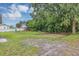 The backyard has a large tree and grass at 405 Willow Ave, Sanford, FL 32771