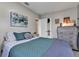 Comfortable bedroom with a full size bed and decor at 405 Willow Ave, Sanford, FL 32771