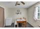 Dining area featuring wooden table, chairs, bench, and natural light at 405 Willow Ave, Sanford, FL 32771