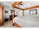 Large bedroom showcasing a luxurious four-poster bed, wooden floors, and decorative furniture at 4065 Shadowind Way, Gotha, FL 34734