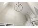 Grand foyer with high ceilings, a modern chandelier, and an open staircase at 4065 Shadowind Way, Gotha, FL 34734