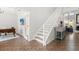 Bright foyer featuring tile flooring, staircase, and views of the living spaces at 4065 Shadowind Way, Gotha, FL 34734