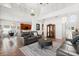 Bright living room featuring high ceilings, tile floors, and an open floor plan with easy access to the kitchen at 4065 Shadowind Way, Gotha, FL 34734