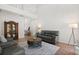 Spacious living area showcasing tile flooring, neutral paint colors, and stairs leading to the second floor at 4065 Shadowind Way, Gotha, FL 34734