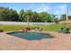 Backyard pool area with brick pavers, hot tub, lounge chairs, and umbrella, surrounded by lush greenery at 4065 Shadowind Way, Gotha, FL 34734