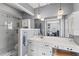 Stylishly updated bathroom with glass shower, gray walls, decorative lighting and white vanity at 407 Westchester Dr, Altamonte Springs, FL 32701